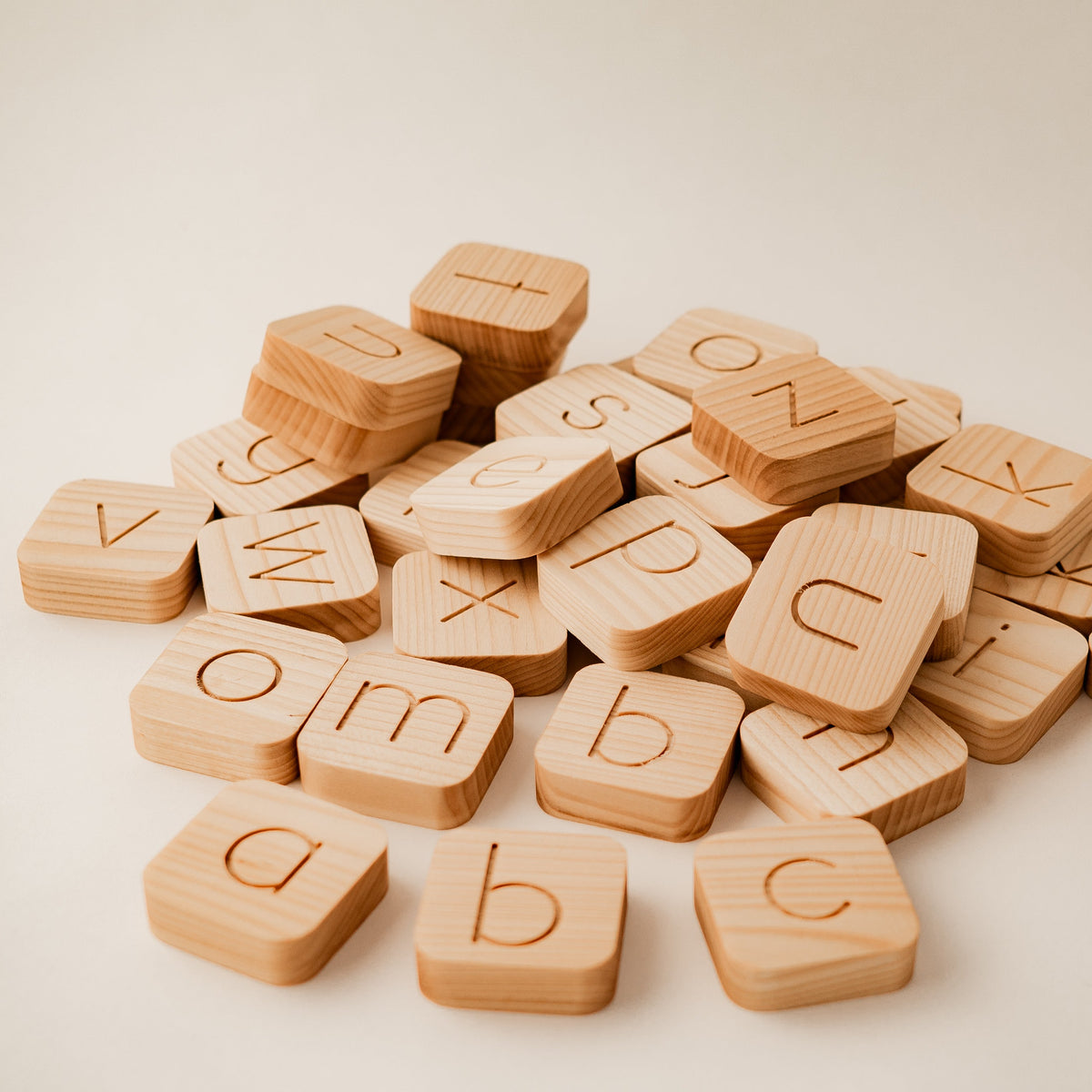Wooden alphabet blocks on a light background